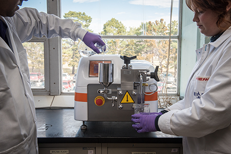 Student with lab equipment