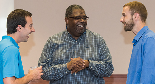 three students having a friendly discussion