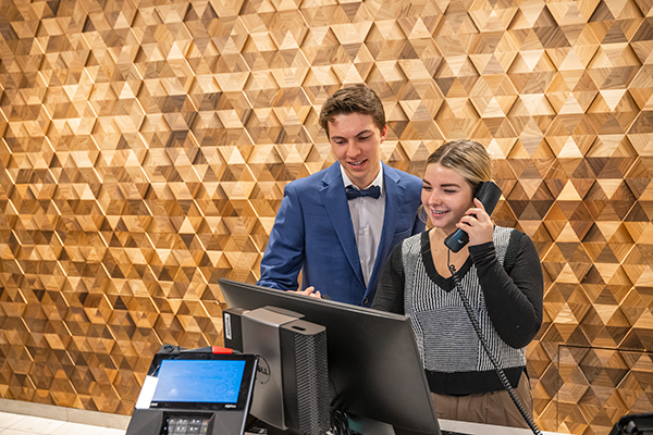 Hotel employees at front desk