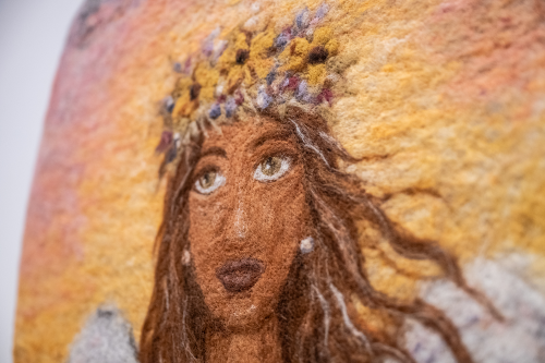 Close-up of Prairie Angel face needle felted coffin cover